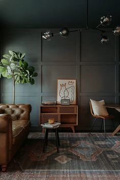 a living room filled with furniture and a potted plant