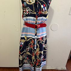 This Beautiful Nautical Dress Is Sleeveless, Buttons Down The Front, Is Unlined, Has Elastic In The Waist Front And Back, And Has A Red Belt. The Bust Is 36, The Waist.Is 26, The Hip Is 42, And The Length Is 46. This Dress Is New With Tags And Has No Blemishes. Navy Casual Beach Dress, Beach Sleeveless Midi Dress Lined, Beach Midi Sleeveless Lined Dress, Navy Midi Dress For Summer Vacation, Navy Marine Style Summer Dress, Zara Sleeveless Summer Dress For Beach, Navy Sleeveless Summer Dress, Zara Sleeveless Summer Beach Dress, Zara Summer Sleeveless Dress For Beach