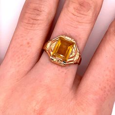 Vintage 1940's 10k yellow gold yellow stone ring. The ring size is a loose 9, and can be resized. The height of the ring off of the finger is 3.9mm. The width of the band is 3.7mm, and tapers down to 2.8mm. Antique Engraved Yellow Gold Ring With Gemstone, Gold Citrine Heirloom Rings, Antique 14k Gold Signet Ring With Gemstone, Antique Gold Signet Ring With Gemstone, Victorian Gold Signet Ring With Gemstone, Antique Emerald Ring In Stamped 14k Yellow Gold, Vintage Yellow Gold Sapphire Ring Collectible, Classic Gold Citrine Rings, Classic Yellow Gold Citrine Birthstone Ring