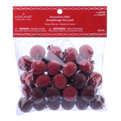 red raspberries in cello bag on white background