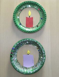 two paper plates with candles on them