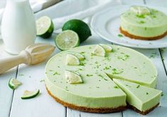 there is a lime cheesecake on the table with slices cut out and ready to be eaten