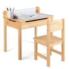 a wooden table with two chairs and a drawing board on it's top that has colored pencils in it