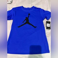 Jordan T-Shirt Boys Size M 10/12 Can Fit Women Size S Royal Blue Color Brand New With Tag Nike Blue Short Sleeve T-shirt, Blue Nike T-shirt With Logo Print, Nike Blue T-shirt With Logo Print, Nike Blue Graphic Tee, Pre-shrunk Blue Nike Tops, Nike Azul, Latest Jordans, Jordan T Shirt, Blue And White Shorts