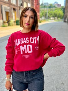 Super cozy oversized Kansas City sweatshirt Crew neckline Dropped shoulders Ribbed knit trim Mid-weight sweatshirt Oversized relaxed fit silhouette 60% Cotton, 40% Polyester Machine wash cold Elina (model) wears a small Ember wears a medium Model measurements: Height: 5’4”, Bust: 34”, Waist: 26”, Hips: 39” Color may vary due to lighting on image Red Oversized Crew Sweatshirt, Oversized Red Sweater With Letter Print, Red College Sweatshirt For Fall, Red Sweatshirt For College In Fall, Red Sweats With Ribbed Cuffs For Fall, Cozy Red Sweatshirt With Ribbed Cuffs, Red Sweats For Fall Loungewear, Red Fall Loungewear Sweats, Oversized Red Sweatshirt With Ribbed Cuffs