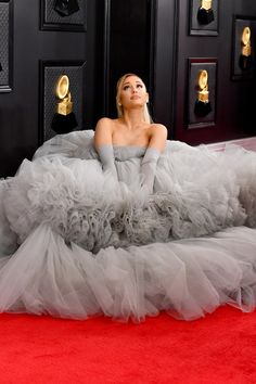 lady in grey gown laying on red carpet at the 60th annual cma awards news photo