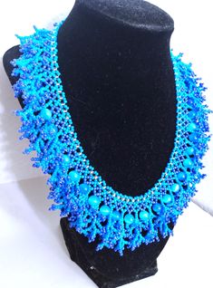 A handmade glass beaded necklace that is perfect for any occasion: parties, holidays, birthdays, anniversaries. All products are hand-crafted by my mother. Dimensions: - Length: 28.5 cm - Width: 22.0 cm - Height: 2.0 cm Lightweight, high quality with a beaded hook as a clasp.  Acrylic Pearls: 8 mm. Will respond to concerns and suggestions promptly. Shipping costs: Free Domestic Shipping. All orders are sent by air-mail with tracking number. Time of delivery: Estimated 1-3 days for domestic shipping; international make take 7-14 days. Feel free to check out our other similiar products! https://noorsjewelers.etsy.com Blue Beaded Necklace For Gift, Blue Beaded Czech Glass Necklaces, Blue Beaded Bib Necklace With Round Beads, Blue Colorful Beads Necklace For Wedding, Blue Necklace With Colorful Beads For Wedding, Blue Wedding Necklaces With Colorful Beads, Blue Wedding Necklace With Colorful Beads, Czech Glass Beaded Necklaces With Polished Beads For Party, Czech Glass Polished Bead Necklaces For Party