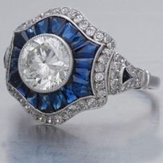 "𝐃𝐞𝐬𝐜𝐫𝐢𝐩𝐭𝐢𝐨𝐧 : *Antique Filigree Ring, Round With Blue Sapphire Baguette Cut CZ Diamond Ring, Gold Or Wedding Ring, Gift For Mother, Edwardian Retro Ring. ❖ 𝐃𝐢𝐚𝐦𝐨𝐧𝐝 𝐃𝐞𝐭𝐚𝐢𝐥𝐬 *Color : White, Blue *Clarity : VVS *Cut : Excellent *Center Stone Shape : Round Cut *Center Stone Size : 7.00 MM *Center Stone Weight : 1.33 CT *Type : Cubic Zirconia (CZ) *We have all types of fancy & color Gemstone. For more queries please contact us immediately. ❖ 𝐑𝐢𝐧𝐠 𝐃𝐞𝐭𝐚𝐢𝐥𝐬 *Metal Purity : Solid Gold (10K, 14K, 18K); 925 Sterling Silver *Stamp : Yes (As per metal purity) *SKU : SR4186 *Making Process : Handmade > Crafted by our experienced craftsman. ❖ 𝐂𝐮𝐬𝐭𝐨𝐦𝐢𝐳𝐚𝐭𝐢𝐨𝐧 *Buyer can Request change of rhodium color in 925 Silver Jewelry (No additional Charges). *In Gold ( Luxury Intaglio Sapphire Ring For Anniversary, Deco Rings, Ladies Jewellery, Antique Style Rings, Edwardian Ring, Sapphire Wedding Rings, Antique Filigree, Vintage Engagement Rings Unique, Simulated Diamond Rings