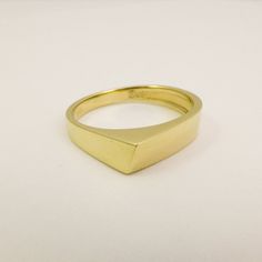 14K / 18K Solid Gold Geometric Ring for Men and Women, Wide Triangle Wedding Band Ring made of Yellow, White or Rose Gold. This ring is not symmetric in any way, the sides of the ring have different widths and it performs an interesting game of angles and geometric shapes. Wide, modern and bold design that was made to be playful and fun to wear. Strong and boldly shaped as a tiny gold sculpture, would make a great alternative wedding ring. Allowing many stacking options with other geometric desi Modern Gold Signet Promise Ring, Modern Yellow Gold Signet Ring With Diamond Cut, Modern Gold Couple Rings For Formal Occasions, 14k Yellow Gold Signet Promise Ring, Minimalist Yellow Gold Promise Signet Ring, Modern 14k Gold Signet Ring For Wedding, Minimalist 14k Gold Diamond Cut Signet Ring, Modern Gold Signet Ring For Wedding, Modern Diamond Cut Signet Ring As Gift