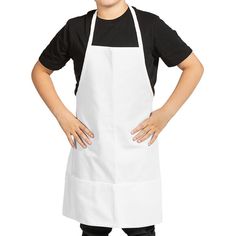 a young boy wearing an apron posing for the camera