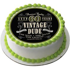 a white cake with green icing and black lettering on top that says age 60 years vintage dude