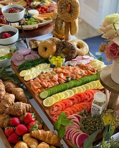 an assortment of fresh fruits and pastries on a buffet table