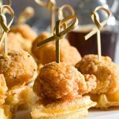 small appetizers are arranged on a plate with toothpicks in the shape of crosses