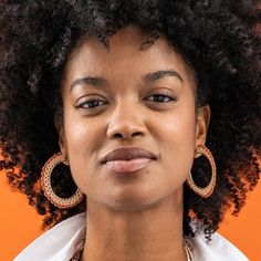 They're not your grandma's crochet, but she'd totally approve. These handwoven seed bead earrings offer a funky fresh take on the most classic shape – the hoop! These lightweight cuties are about to become your new everyday favorites. Style tip: We're big believers that rust, blush, and cream-colored beads are neutrals, and thus go with literally everything in your wardrobe. Reach for them the next time you head out the door + you'll see what we mean. --DETAILS-- 2.25" L x .09" W Handmade by skilled artisans in India Hypoallergenic nickel + lead-free brass hardware These accessories are made by human hands. A slight variation in size and color is considered part of the beauty of these one-of-a-kind pieces. To extend the life of your accessories, store them in a dry place while swimming, sh Adjustable Beaded Earrings For Everyday Wear, Bohemian Beaded Earrings For Everyday, Everyday Bohemian Beaded Earrings, Affordable Statement Pink Beaded Earrings, Colorful Beaded Brass Dangle Earrings, Bronze Beaded Brass Earrings, Adjustable Macrame Beaded Earrings, Bronze Dangle Beaded Brass Earrings, Orange Bohemian Nickel-free Hoop Earrings