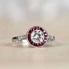 Vintage White Diamond Ring With Halo Setting, Gia Certified Cluster Halo Ring For Anniversary, Classic White Diamond Ruby Ring, Classic White Round Cut Ruby Ring, Classic White Ruby Ring With Round Cut, White Diamond Ruby Ring, Vintage Gia Certified Round Cut Halo Ring, Vintage White Wedding Ring With Halo Setting, White Vintage Wedding Ring With Halo Setting