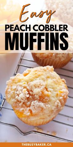 two muffins on a cooling rack with the words easy peach cobbler muffins