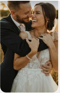 a man and woman are hugging each other