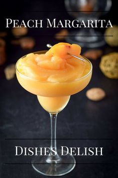 the peach margarita is served in a martini glass with a garnish on top