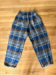 Most amazing women’s vintage express plaid gaucho pants High waisted Buttons at waist and zipper fly Side pockets No pockets in back Excellent vintage condition Ramie and rayon material Tag reads size 7/8 Measurements taken flat are Waist: 12.5 in Hips: 16 in Rise: 16 in Inseam: 26 in Full length: 39.5 in longAll sales are final Thanks for checking out Cereal Vintage Thrift Recycle Reuse Recreate Vintage Wide Leg Linen Bottoms, Vintage Plaid Pants For Fall, Vintage Wide Leg Plaid Bottoms, Fitted Vintage Plaid Bottoms, Relaxed Fit Plaid Pants With Elastic Waistband, Vintage Relaxed Fit Pants With Elastic Waistband, Vintage Pants With Elastic Waistband And Relaxed Fit, Vintage High Waist Plaid Bottoms, Retro Plaid Bottoms With Pockets