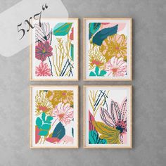 four framed art pieces with flowers and leaves on them, each featuring different colors in the same