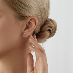 Crafted from real 14K or 10K solid gold, Kiera dainty gold halo studs are tarnish free and 100% hypoallergenic—nickel free, lead free, and safe for even the most sensitive skin. They can be worn in the shower and will endure for years to come. Metal: 14K Gold or 10K Gold Stone: Cubic Zirconia Back Findings: Gold Silicon Backs Item Number: JEE27219 - JEE27222 Halo Stud Earrings, Round Halo, Halo Earrings, Halo Earrings Studs, Classic Earrings, Cubic Zirconia Jewelry, Diamond Simulant, Gold Halo, Gold Stone