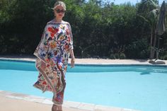 Summer garden silk caftan will brighten your day with it's lush floral pattern displayed on a white background. One size.  Fits small to X-large sizes.  The width is 52 inches, edge to edge or 104 inches around the body.  The side seams are 6 inches from the edge, giving  80 inches of body room and an elegant flowing movement.  The length is 50 inches. Machine wash on a short delicate cycle or hand wash. Bohemian Silk Kaftan For Daywear, Silk Bohemian Kaftan For Daywear, Patterned Silk Kaftan For Spring, Spring Silk Patterned Kaftan, Silk Patterned Kaftan For Spring, Spring Vacation Silk Kaftan, Silk Kaftan With Vibrant Print For Summer, Multicolor Silk Kaftan For Summer, Spring Holiday Bohemian Kaftan