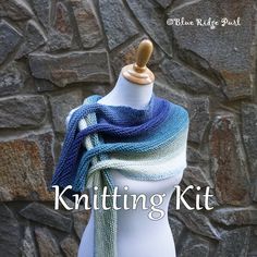 a knitted scarf on top of a white mannequin head with the words knitting kit written below it