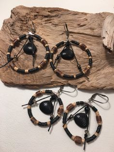 Beaded Wood Dangling Hoop Earrings with Vintage Jet Glass Petal Beads and Stainless Steel Leverback Ear Wires. Mixed wood and coco beads in natural brown bark and dyed black with waxed black hemp cord. Fun and light easy to wear. 2 sizes are available, Large-2 1/2" hoop Small-2" hoop Adjustable Round Beaded Earrings For Festivals, Adjustable Hoop Jewelry With Wooden Beads, Adjustable Black Beaded Hoop Jewelry, Adjustable Round Black Beaded Earrings, Adjustable Brown Hoop Earrings For Festival, Brown Hoop Earrings For Festivals, Adjustable Black Beaded Earrings For Festival, Adjustable Festival Earrings With Wooden Beads, Festival Earrings With Wooden Beads