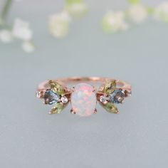 Opal Diamond Ring, 14K Rose Gold Engagement Ring, Marquise Peridot Aquamarine Ring, Floral Art Deco, Delicate Wedding Ring, Anniversary Gift Brand - LATELIERDBIJOUX Type Of Stone - Opal Cut of Stones - Oval Stone size - 8 x 6 MM Secondary Stone - Peridot Stone Shape - Marquise Stone Size - 4 x 2 mm Stone Color - Green Third Stone - Aquamarine Stone Shape - Marquise Stone Size - 4 x 2 mm Stone Color - Blue Forth Stone - CZ Diamond Stone Shape - Round Stone Color - Colorless Check out my other ite Oval Topaz Ring For Wedding, May Birthstone, Oval Multi-stone Emerald Ring For Wedding, Green Multi-stone Topaz Wedding Ring, 14k Gold Emerald Ring With Gemstone Accents For Wedding, Green Multi-stone Topaz Ring For Wedding, Heirloom Opal Ring With Gemstone Accents For Wedding, Green Opal Wedding Jewelry, Oval Multi-stone Birthstone Ring For Wedding, Heirloom Topaz Wedding Ring With Gemstone Accents