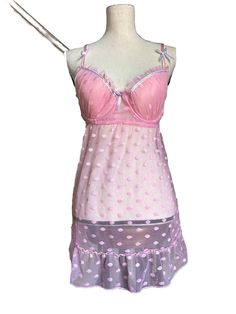 Indulge In A Playful And Comfortable Night's Sleep With This Pink Polka Dot Nightgown. The Gown Features A Sweetheart Neckline, Sleeveless Design, And An Elastic Closure For A Comfortable Fit. Made Of Lightweight Nylon Mesh, This Babydoll Style Gown Has Adjustable Straps And A Padded Bust For Added Support. The Garment Care Instructions Recommend Hand Washing Only. Designed With Charming Accents Including A Ruffle, Bow, And Strap, This Gown Is Perfect For Sleepwear And Lounging Around The House. Polka Dot Sleepwear For Pajama Party In Summer, Polka Dot Sleepwear For Summer Pajama Party, Summer Polka Dot Sleepwear For Pajama Party, Polka Dot Summer Sleepwear, Summer Coquette Nightgown For Bedtime, Coquette Nightgown For Bedtime In Summer, Coquette Summer Nightgown For Bedtime, Summer Coquette Style Nightgown For Bedtime, Coquette Summer Nightgown For Sleep