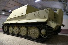 an army tank is on display in a museum