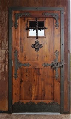 an old wooden door with iron accents