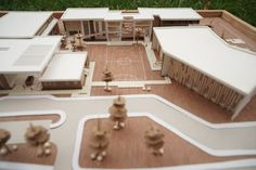 a model of a basketball court with people playing in the yard and on the ground