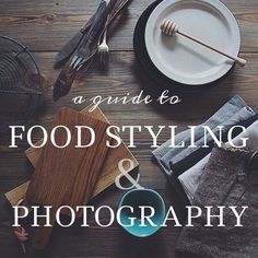 a table topped with plates and utensils on top of a wooden floor covered in food