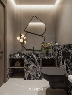 a modern bathroom with black and white marble