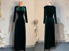 two mannequins dressed in long green dresses