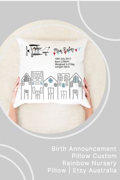 the birth announcement pillow is being held up by someone holding it in front of their face