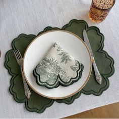 a place setting with napkins and silverware