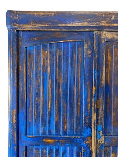 an old blue wooden door with bars painted on it