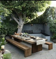 an outdoor dining area with table and benches