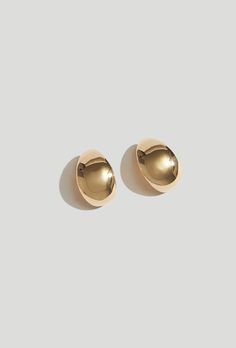 An everyday staple, the Gold Huggie Earrings flow along the curve of your ear. Hand cast in Brass and plated with 14K Gold Plate. Also available in Sterling Silver.