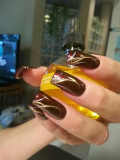 Maroon Nails With Gold Accent, Raspberry And Gold Nails, Burgundy Nails With Gold Tips, Maroon Nails Gold Accent, Maroon Nails With Gold Design, Maroon Black And Gold Nails, Oxblood And Gold Nails, Burgundy Nails With Gold Design, Cooper Nails Design