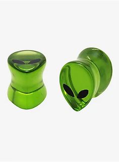 an alien head glass stopper is shown in the middle of two different sizes and colors