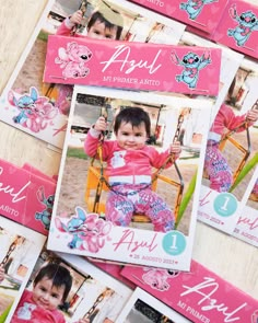 some pink and blue cards with pictures of children's faces on them, sitting next to each other