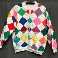 a white jacket with multicolored squares on it