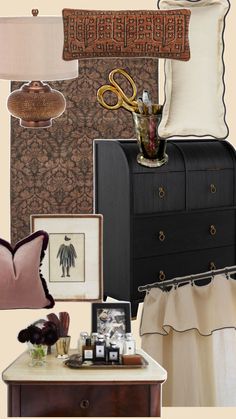 there is a black dresser with pictures on it and other items in front of it