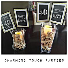 three vases filled with wine corks sitting on top of a table next to candles