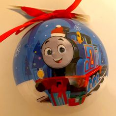 a thomas the train ornament hanging on a wall