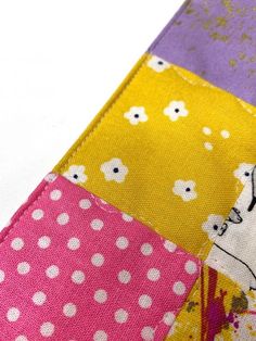 a close up of a colorful patchwork material