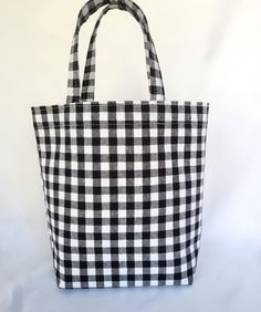 Gift giving is fun and easy when you compliment your present with this black and white gingham cotton handmade bag.  It is an unique way to give a gift as a thank you, hostess gift, birthday, or use as a small project tote.  Made of cotton fabric lined with interfacing for durability and stability for holding heavier gifts.  Gift bags are an easy way to prepare, add tissue paper and your ready to go.  Fabric bags are reusable, durable, and can be used for many different purposes. Carry small boo White Cotton Bag For Picnic, White Cotton Picnic Bag, White Cotton Picnic Bags, Rectangular Cotton Gingham Bags, Rectangular Gingham Cotton Bags, Gingham Tote Bag, Black And White Gingham, Wrapping Party, Small Book